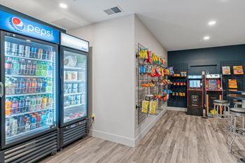 a convenience store with refrigerators and shelves of soda and other drinks